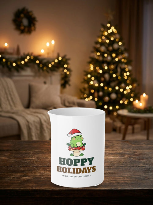 Hoppy Holidays Frog Christmas Mug in a styled table product photo