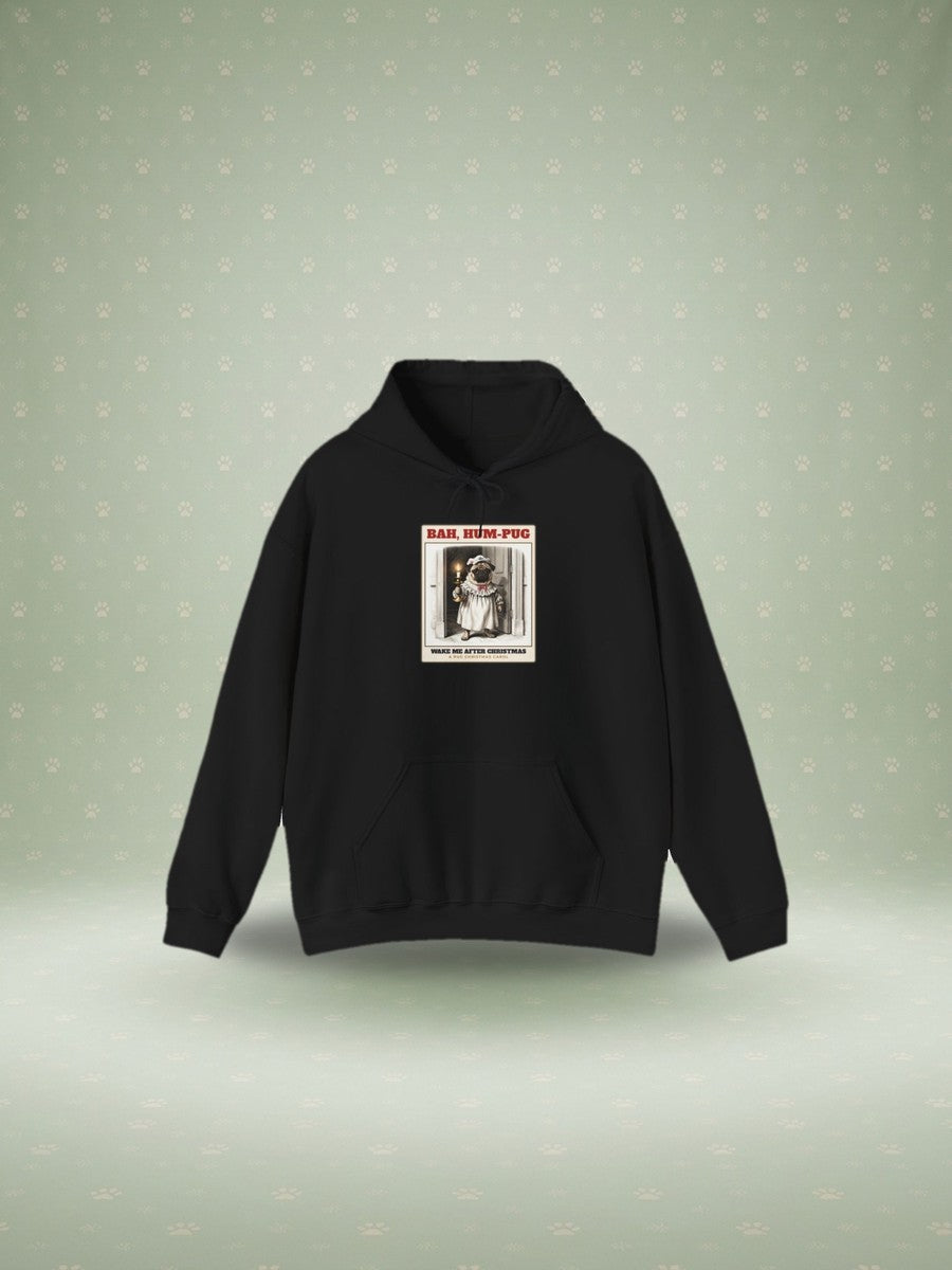 Bah Hum-Pug Christmas hoodie in a festive studio scene