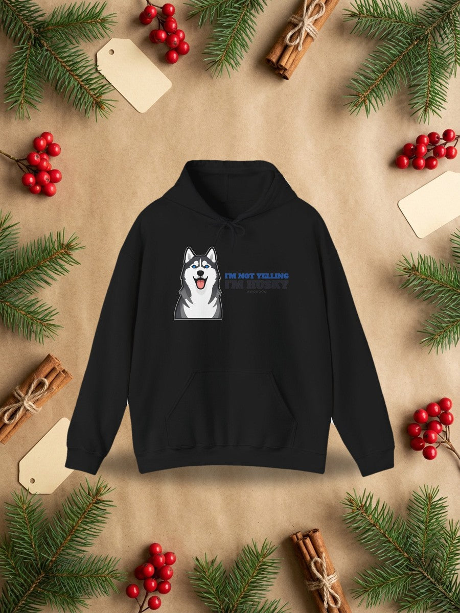 I'm Not Yelling, I'm Husky Hoodie in a styled flat lay product photo
