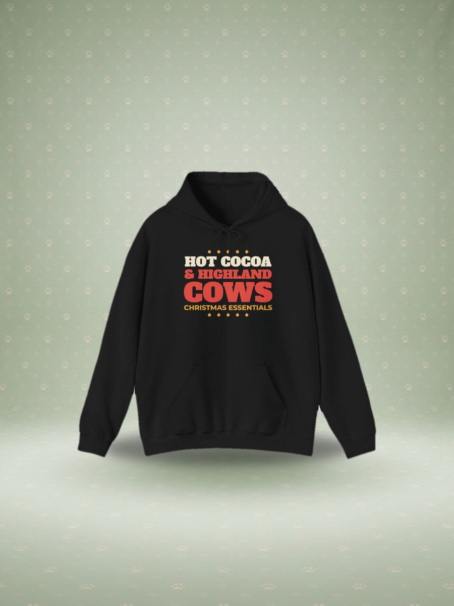 Hot Cocoa and Highland Cows Christmas hoodie in a festive studio scene