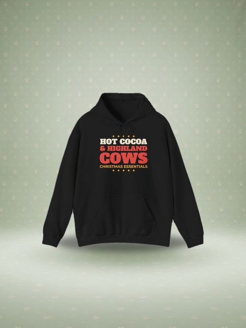 Hot Cocoa and Highland Cows Christmas hoodie in a festive studio scene