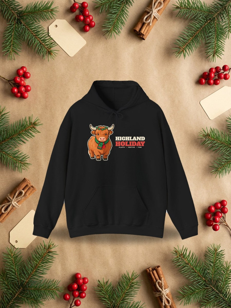 Highland Holiday Cow Christmas Hoodie in a styled flat lay product photo