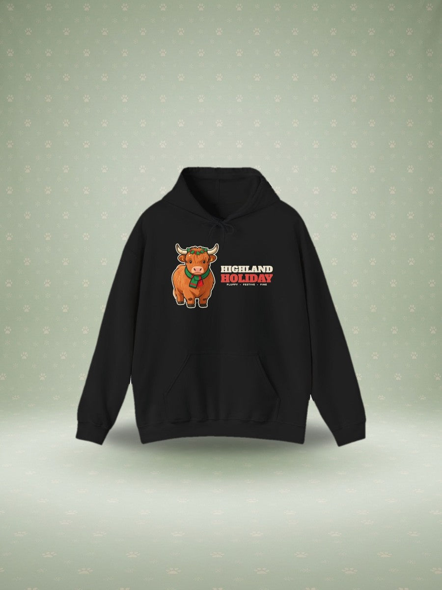 Highland Cow Christmas hoodie in a festive studio scene