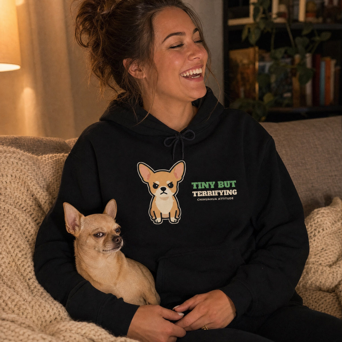 Funny chihuahua hoodie for humans worn on the couch with a side-eye chihuahua - gift for chihuahua lovers