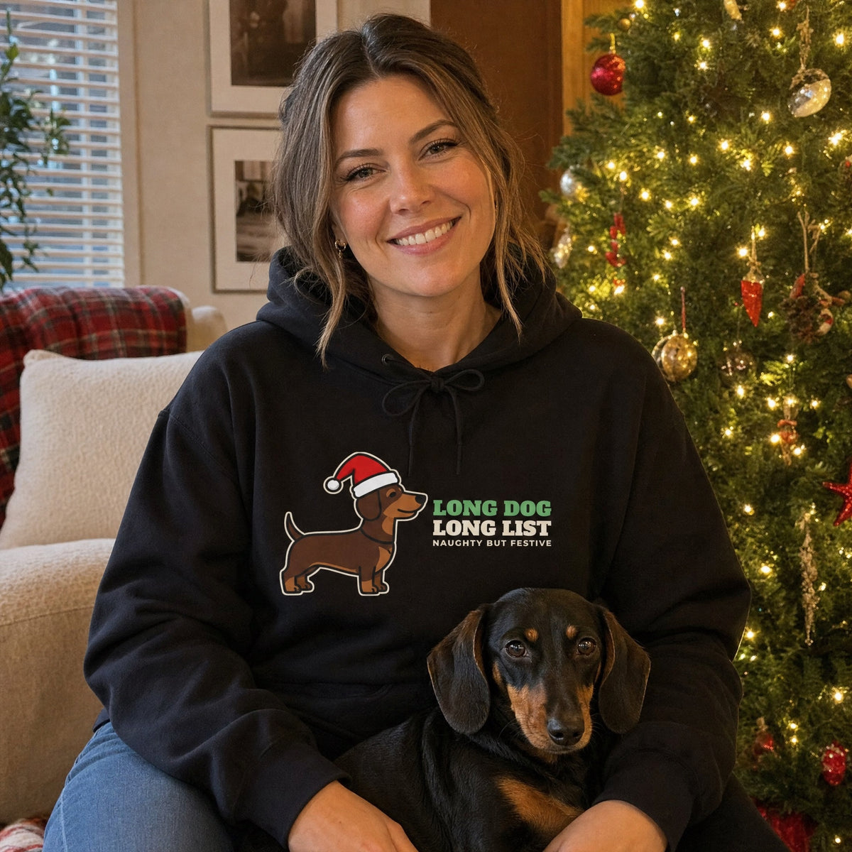Long Dog Long List dachshund Christmas sweatshirt hoodie worn by a dachshund owner at home - holiday gift for wiener dog lovers