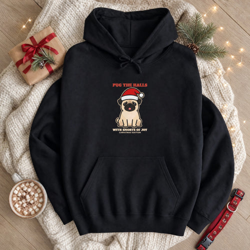 Pug the Halls Christmas hoodie flat lay on a knit blanket with gifts, cocoa and pine - pug lover Christmas gift