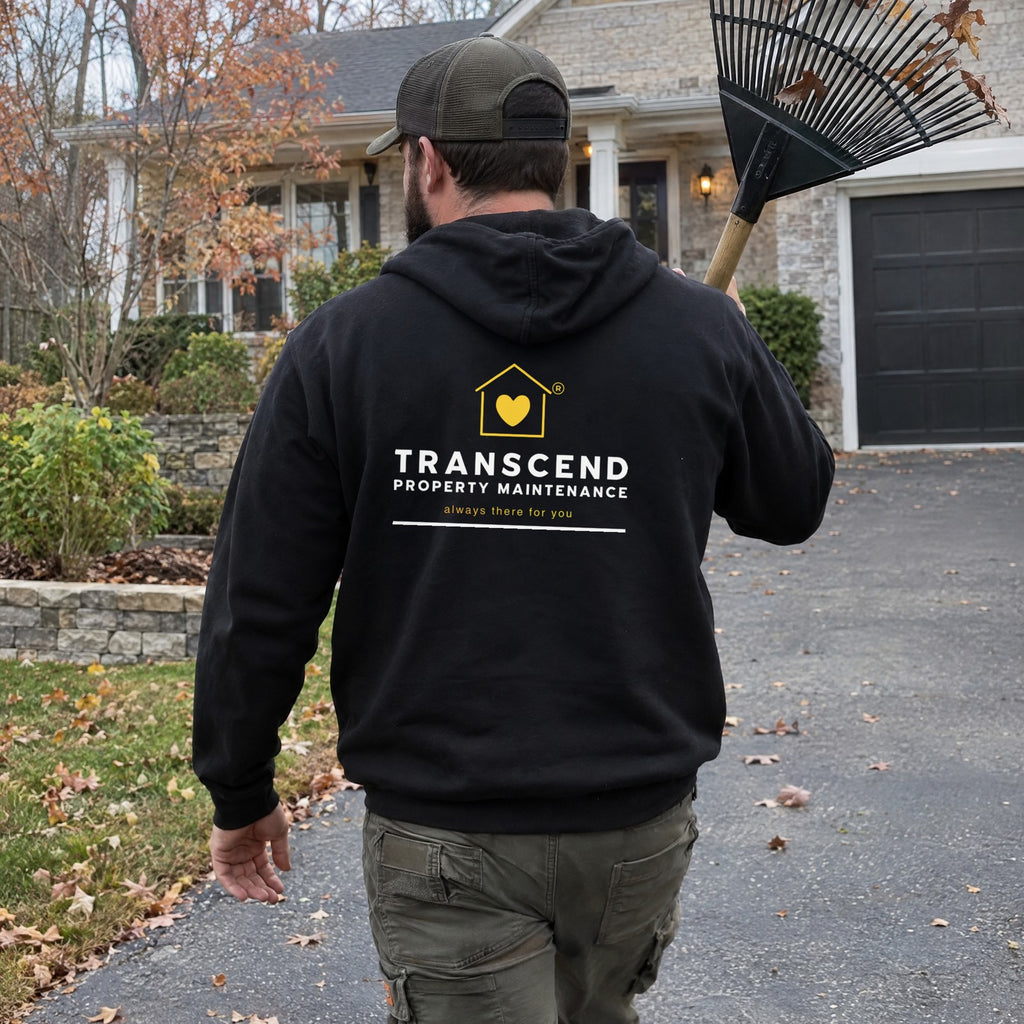 Back view of the Transcend Property Maintenance black hoodie with the large logo on the upper back (AI-generated example photo, logo placement matched to the real product)