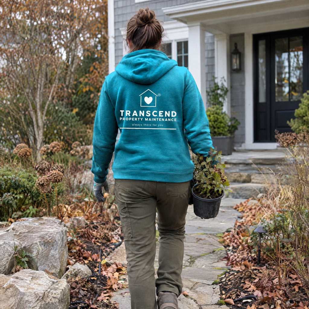 Back view of the Transcend Property Maintenance teal hoodie with the white logo on the back (AI-generated example photo, garment colour and logo placement matched to the real product)