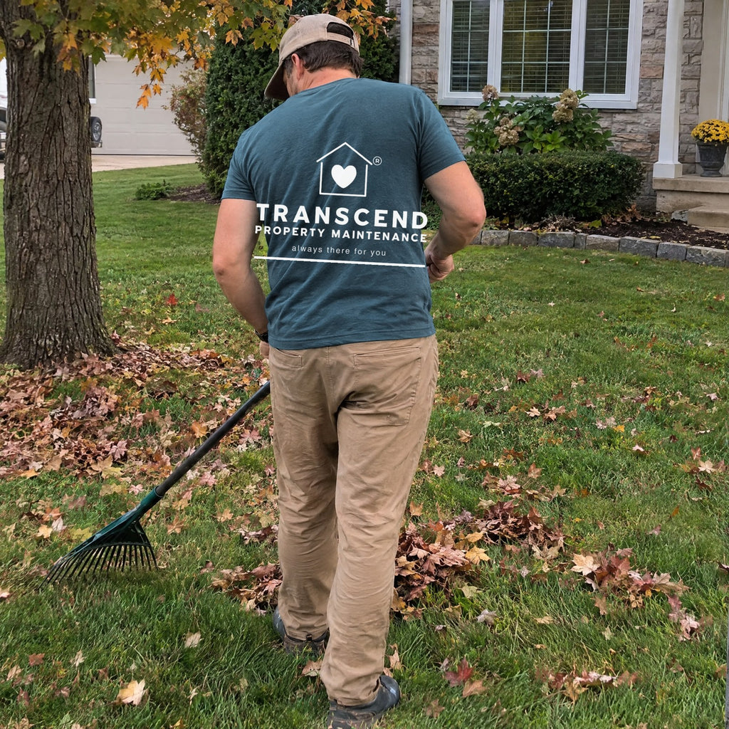 Back view of the Transcend Property Maintenance teal tee with the large white logo across the upper back (AI-generated example photo, garment colour and logo placement matched to the real product)